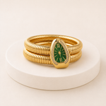 Relógio-serpente dourado com mostrador verde, vista deitada