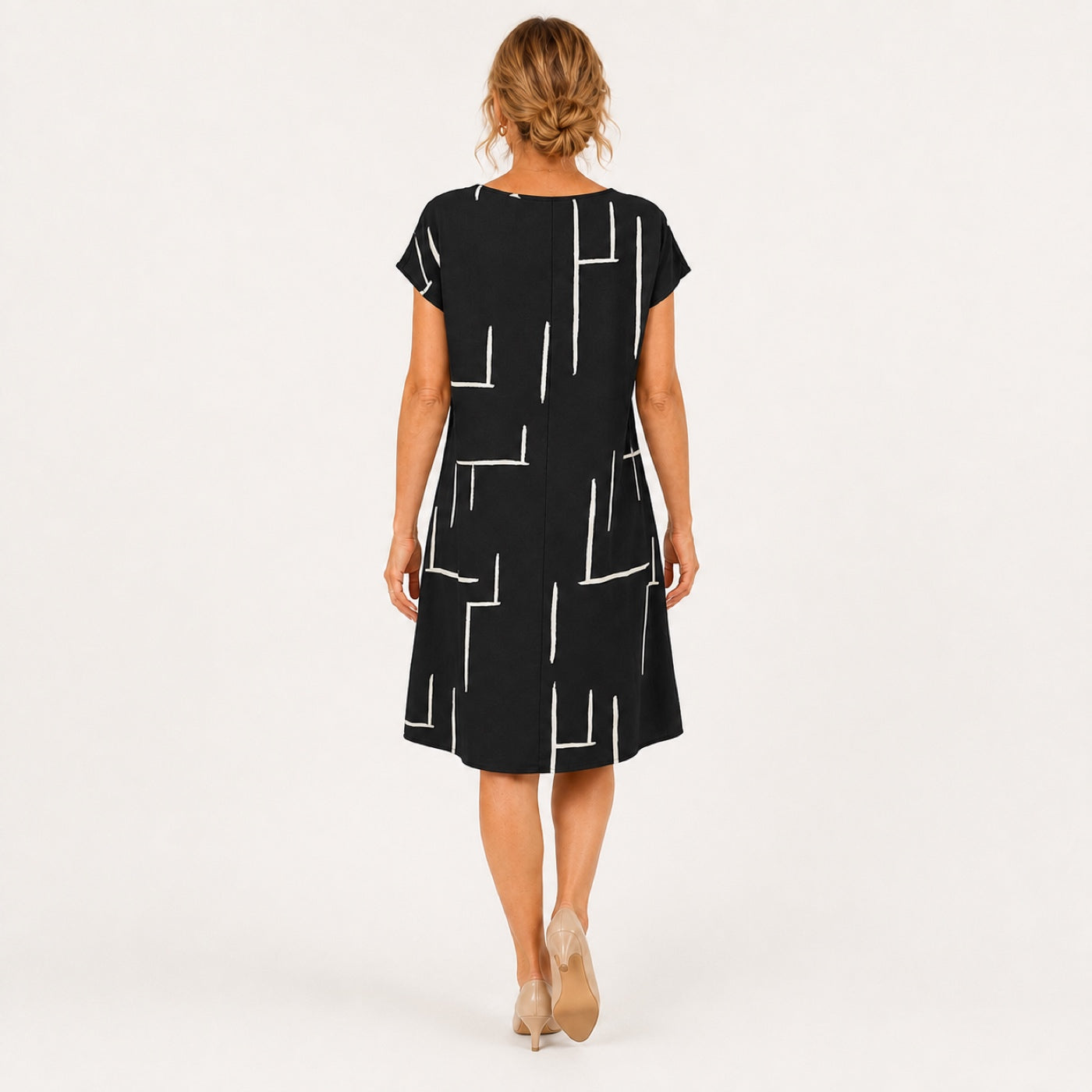 MILOU vestido preto com linhas abstratas — vista traseira