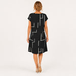 MILOU vestido preto com linhas abstratas — vista traseira